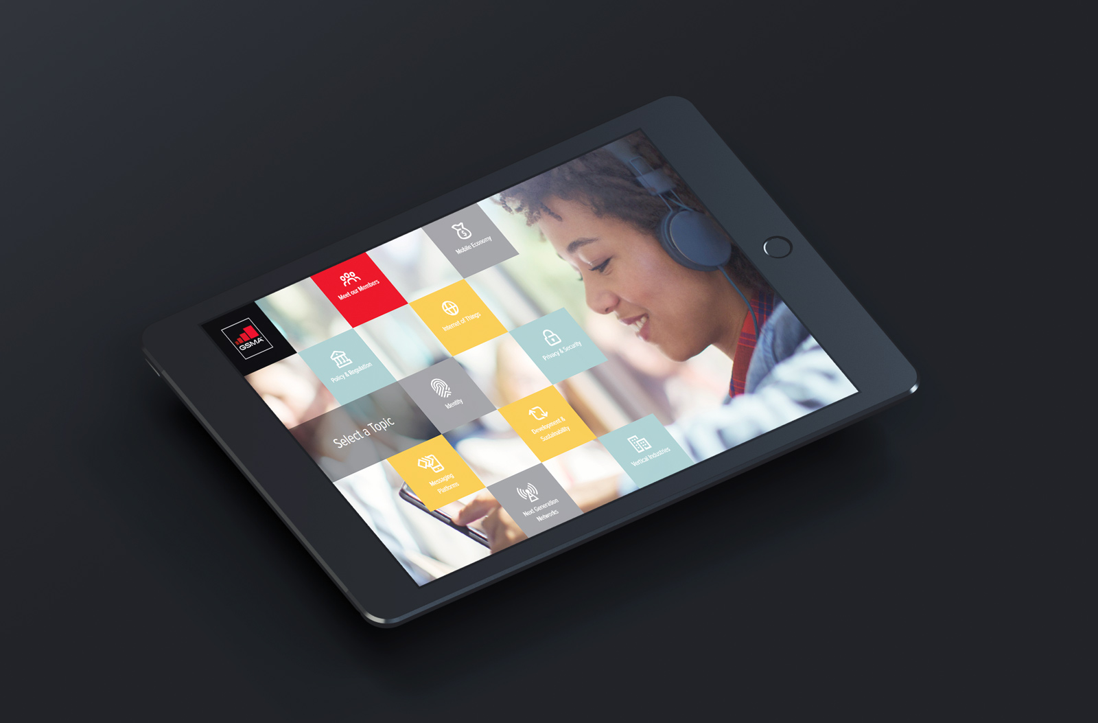 Black tablet displaying DSMA interactive touchscreen digital presentation